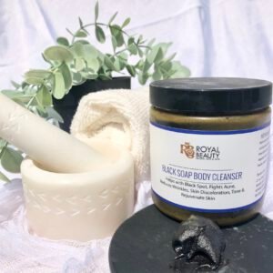 Black soap body cleanser with motar and pestle and white wash cloth