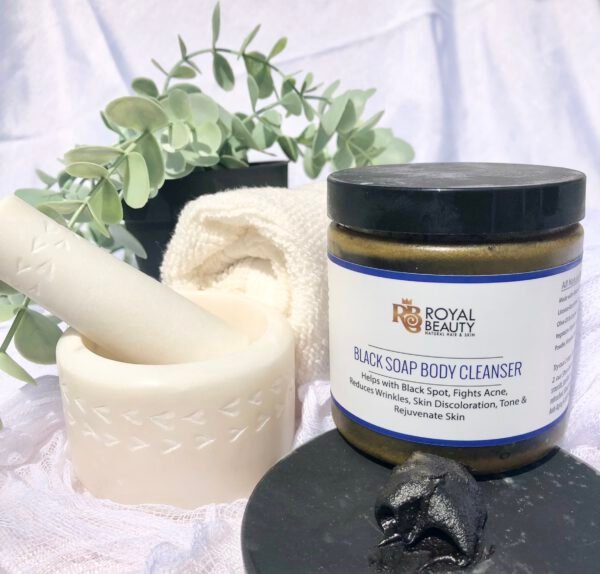 Black soap body cleanser with motar and pestle and white wash cloth